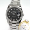 Rolex Datejust 116234 with black diamond dial, 36mm, and 18k bezel.