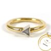 Simple diamond triangle 14k yellow and white gold ring close-up.
