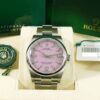 Rolex Oyster Perpetual 36 Candy Pink 126000 watch with box and papers. Rolex logo visible.