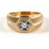 Diamond ring: 14k yellow and white gold two-tone statement ring with round diamond center stone.