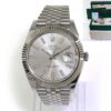 Mint Rolex Datejust 41 126334 with a silver stick dial and jubilee band, including box and papers.