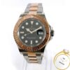 Rolex Yachtmaster 126621 40mm with a black dial, rose gold bezel, and steel/rose gold bracelet. "Rolex Yacht-Master" text visible.