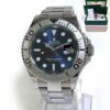 Rolex Yachtmaster with blue dial and platinum bezel, accompanied by its box and papers.