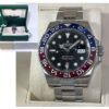 Close-up of a Rolex GMT-Master II with the iconic red and blue Pepsi bezel, showcasing its stainless steel case and Jubilee bracelet design.