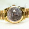 Rolex Day-Date President watch with a mother-of-pearl dial.