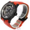 Roger Dubuis watch with intricate skeletonized movement and red leather strap.