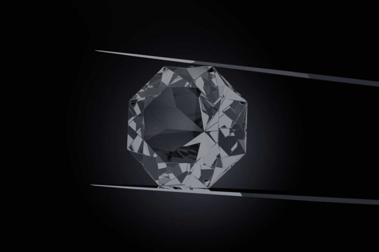 Lab grown diamonds, loose octagonal stone held by jeweler’s tweezers on a black background.
