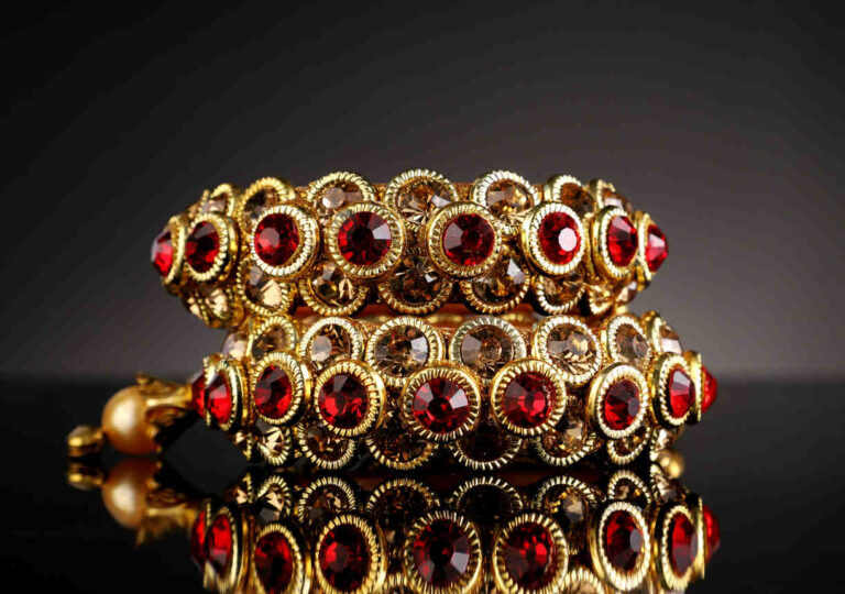 Vintage jewelry Philadelphia ruby and gold bracelet with ornate gemstone details.