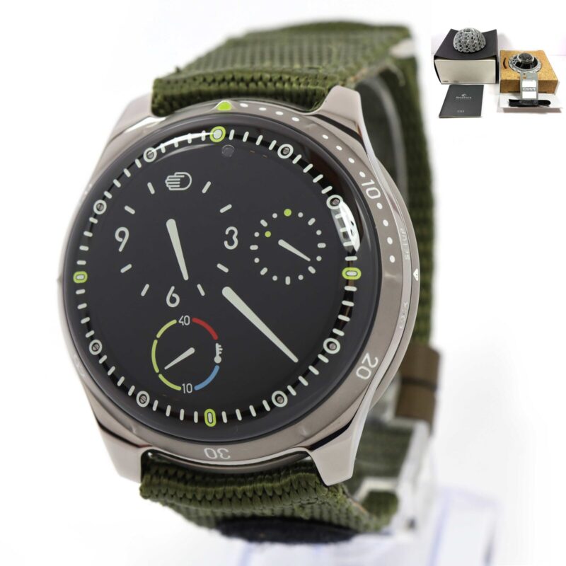 Ressence Type 5 Black watch, 46mm titanium case, green strap, box and papers visible.