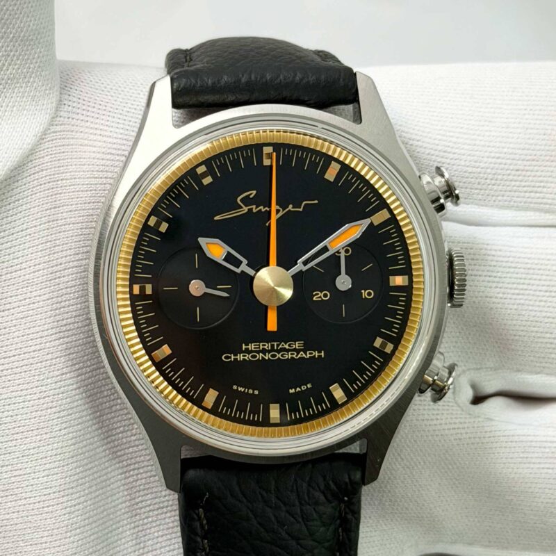 Singer Reimagined Heritage SR601 watch with black dial and gold accents.